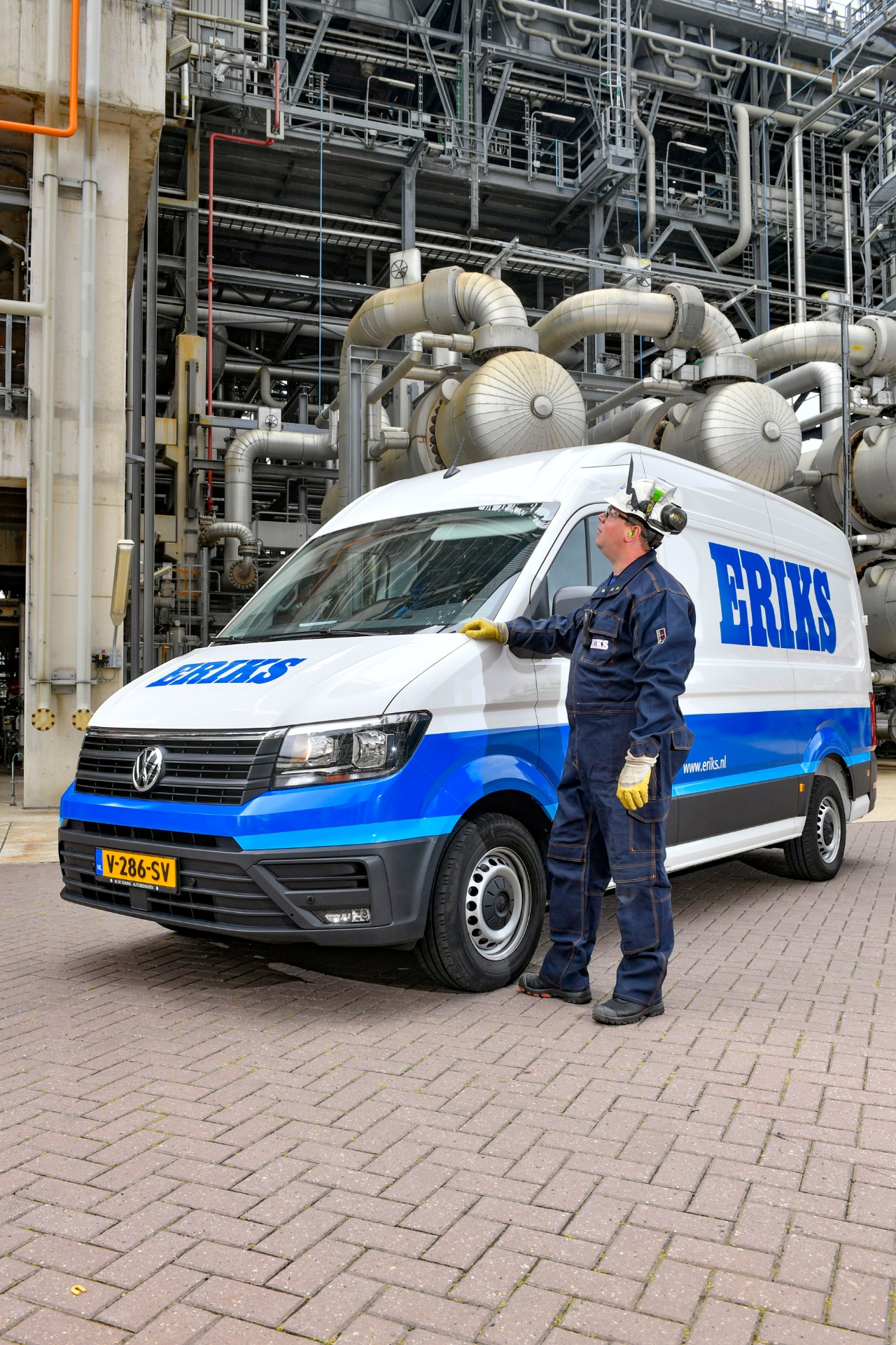 ERIKS employee standing with ERIKS van at client chemical plant